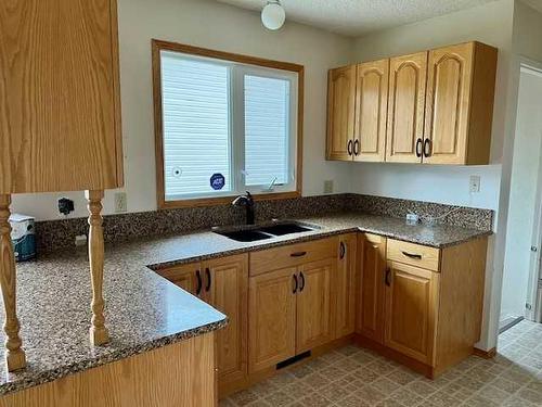 6910 99A Street, Grande Prairie, AB - Indoor Photo Showing Kitchen With Double Sink