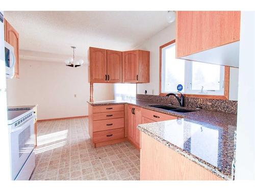 6910 99A Street, Grande Prairie, AB - Indoor Photo Showing Kitchen With Double Sink