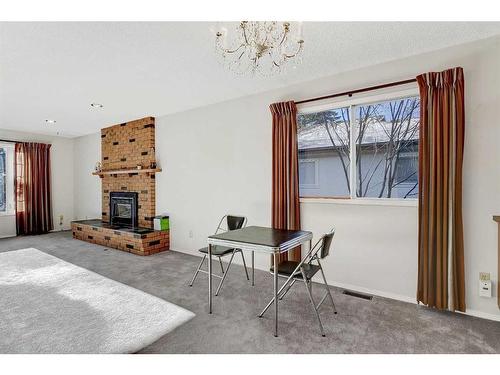 9514 77 Avenue, Grande Prairie, AB - Indoor Photo Showing Living Room With Fireplace