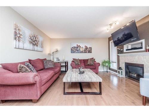 8810 88A Street, Grande Prairie, AB - Indoor Photo Showing Living Room With Fireplace