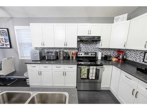 12303 103 Street, Grande Prairie, AB - Indoor Photo Showing Kitchen With Double Sink