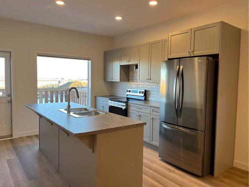 218-11850 84 Avenue, Grande Prairie, AB - Indoor Photo Showing Kitchen With Double Sink