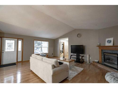 9129 135 Ave, Peace River, AB - Indoor Photo Showing Living Room With Fireplace