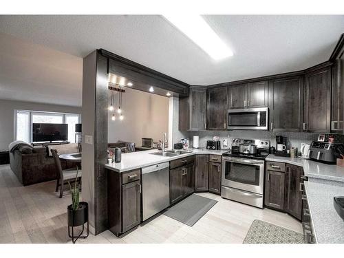 8221 102 Ave, Peace River, AB - Indoor Photo Showing Kitchen With Stainless Steel Kitchen With Double Sink