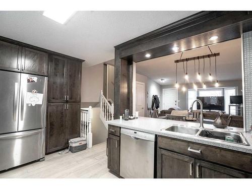 8221 102 Ave, Peace River, AB - Indoor Photo Showing Kitchen With Stainless Steel Kitchen With Double Sink With Upgraded Kitchen