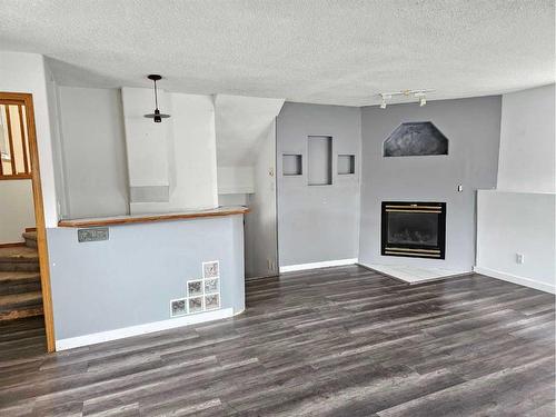 12401 97B Street, Grande Prairie, AB - Indoor Photo Showing Other Room With Fireplace