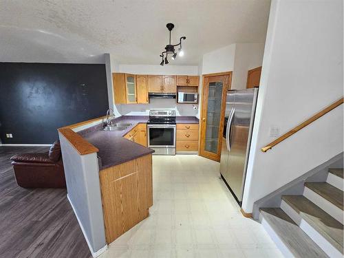 12401 97B Street, Grande Prairie, AB - Indoor Photo Showing Kitchen With Double Sink