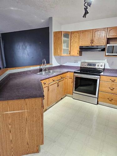 12401 97B Street, Grande Prairie, AB - Indoor Photo Showing Kitchen With Double Sink