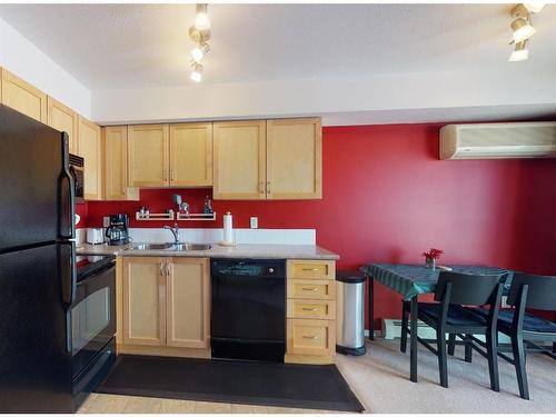 310-11240 104 Avenue, Grande Prairie, AB - Indoor Photo Showing Kitchen With Double Sink