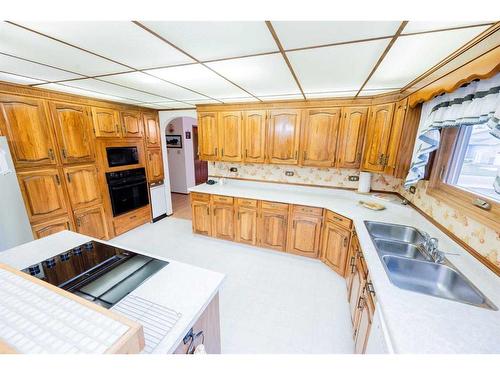 10224 Michaelis Boulevard, Grande Prairie, AB - Indoor Photo Showing Kitchen With Double Sink