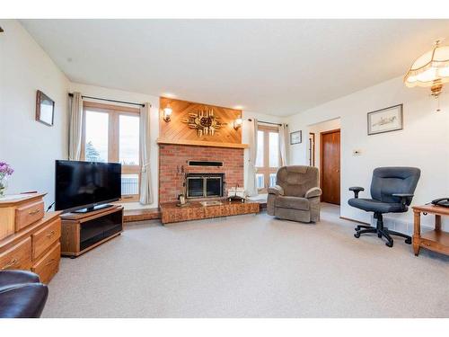 10224 Michaelis Boulevard, Grande Prairie, AB - Indoor Photo Showing Living Room With Fireplace