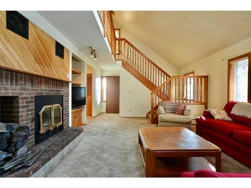 5401 52 Street, Berwyn, AB - Indoor Photo Showing Living Room With Fireplace