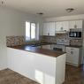 11310 92A Street, Grande Prairie, AB  - Indoor Photo Showing Kitchen With Double Sink 