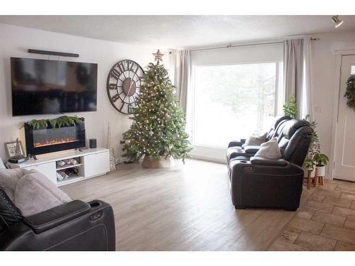 8618 99B Street, Grande Prairie, AB - Indoor Photo Showing Living Room With Fireplace