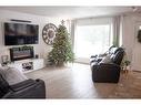 8618 99B Street, Grande Prairie, AB  - Indoor Photo Showing Living Room With Fireplace 