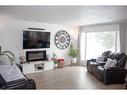 8618 99B Street, Grande Prairie, AB  - Indoor Photo Showing Living Room With Fireplace 