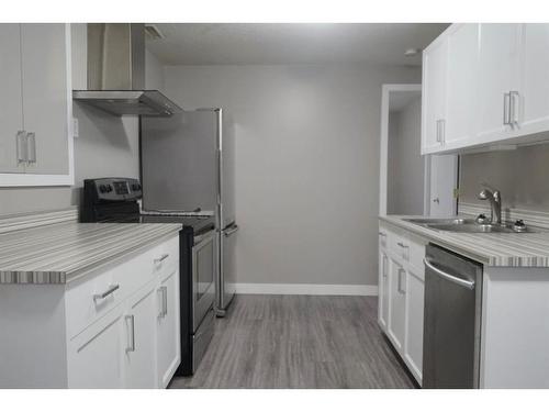 8945 64 Avenue, Grande Prairie, AB - Indoor Photo Showing Kitchen With Double Sink