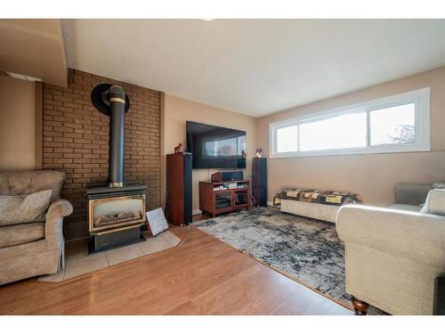 9662 65 Avenue, Grande Prairie, AB - Indoor Photo Showing Living Room With Fireplace