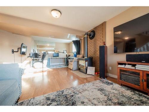 9662 65 Avenue, Grande Prairie, AB - Indoor Photo Showing Living Room With Fireplace