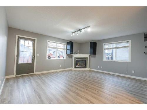 9701 67 Avenue, Grande Prairie, AB - Indoor Photo Showing Living Room With Fireplace