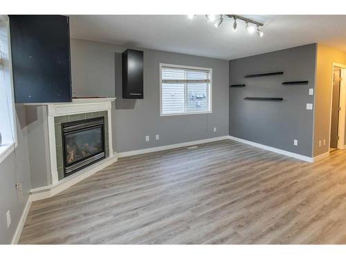 9701 67 Avenue, Grande Prairie, AB - Indoor Photo Showing Living Room With Fireplace