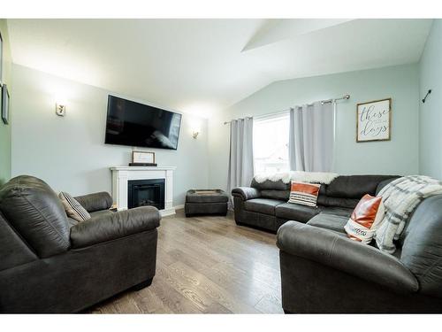 8822 73 Avenue, Grande Prairie, AB - Indoor Photo Showing Living Room With Fireplace