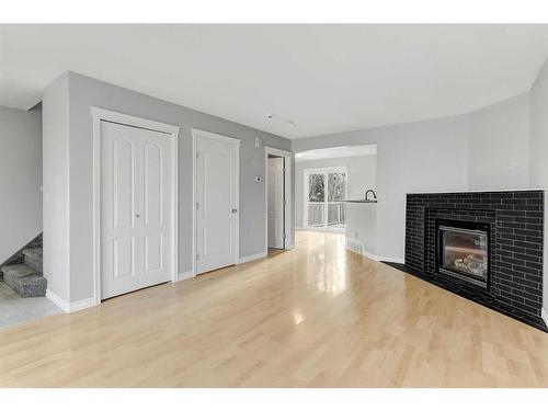 18 Pinnacle Avenue, Grande Prairie, AB - Indoor Photo Showing Living Room With Fireplace