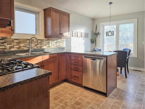 7 - 131 Moberly Road, Grande Cache, AB - Indoor Photo Showing Kitchen With Double Sink