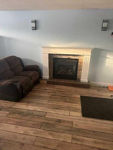 11250 75A Avenue, Grande Prairie, AB - Indoor Photo Showing Living Room With Fireplace