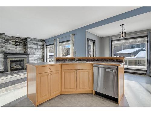 11313 81 Avenue, Grande Prairie, AB - Indoor Photo Showing Kitchen With Fireplace With Double Sink