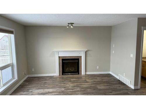 10354 70 Avenue, Grande Prairie, AB - Indoor Photo Showing Living Room With Fireplace