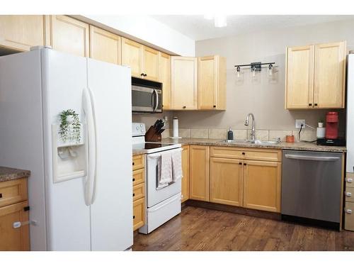 231-10150 121 Avenue, Grande Prairie, AB - Indoor Photo Showing Kitchen With Double Sink