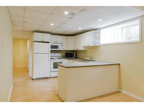 42 Pinnacle Street, Grande Prairie, AB - Indoor Photo Showing Kitchen With Double Sink