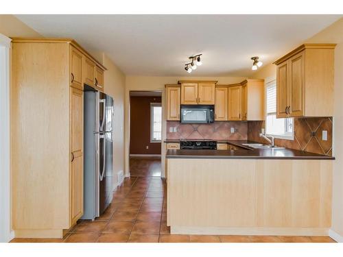 42 Pinnacle Street, Grande Prairie, AB - Indoor Photo Showing Kitchen With Double Sink