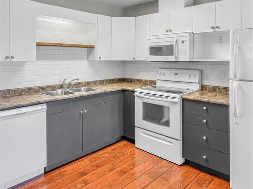 401-12015 Royal Oaks Drive, Grande Prairie, AB - Indoor Photo Showing Kitchen With Double Sink