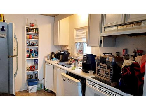 9908 94 Avenue, Wembley, AB - Indoor Photo Showing Kitchen With Double Sink