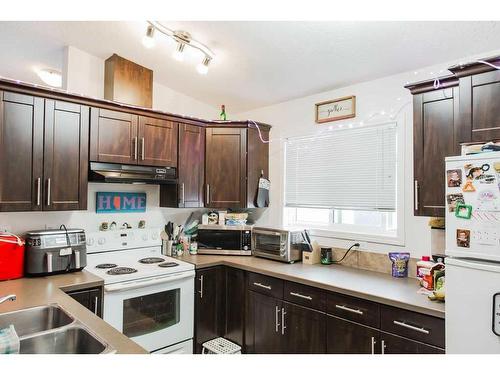 9713 112 Avenue, Clairmont, AB - Indoor Photo Showing Kitchen With Double Sink