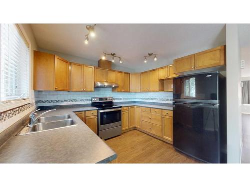 134-9105 91 Street, Grande Prairie, AB - Indoor Photo Showing Kitchen With Double Sink