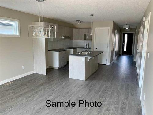 12617 102A Street, Grande Prairie, AB - Indoor Photo Showing Kitchen With Double Sink