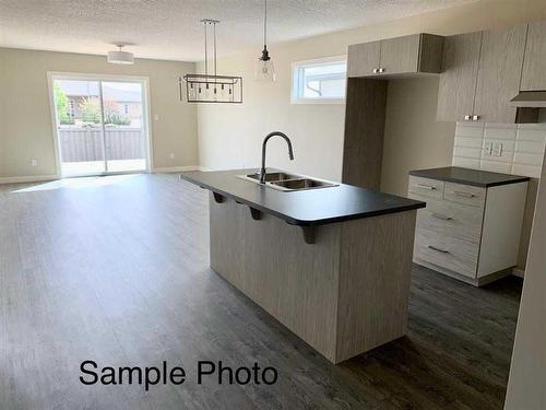 12617 102A Street, Grande Prairie, AB - Indoor Photo Showing Kitchen With Double Sink