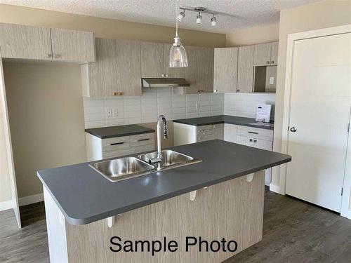 12617 102A Street, Grande Prairie, AB - Indoor Photo Showing Kitchen With Double Sink