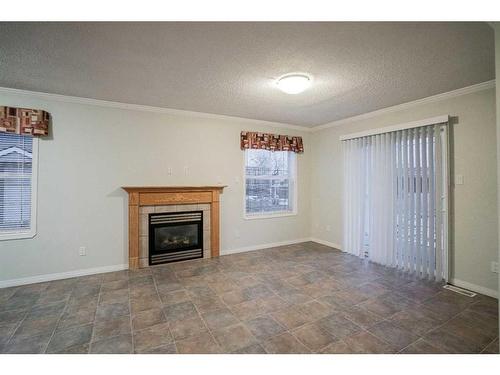 1-6-10709 108 Avenue, Fairview, AB - Indoor Photo Showing Living Room With Fireplace