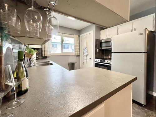 9652 82 Avenue, Grande Prairie, AB - Indoor Photo Showing Kitchen With Double Sink