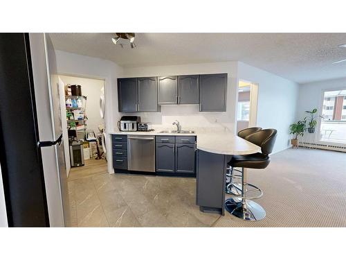 106-9700 92 Avenue, Grande Prairie, AB - Indoor Photo Showing Kitchen With Double Sink