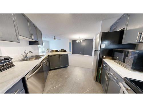 106-9700 92 Avenue, Grande Prairie, AB - Indoor Photo Showing Kitchen With Double Sink