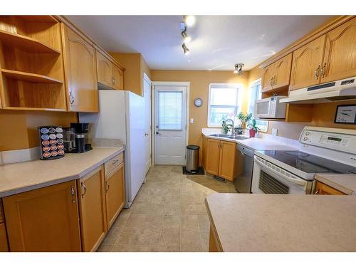 11918 105 Street, Grande Prairie, AB - Indoor Photo Showing Kitchen With Double Sink