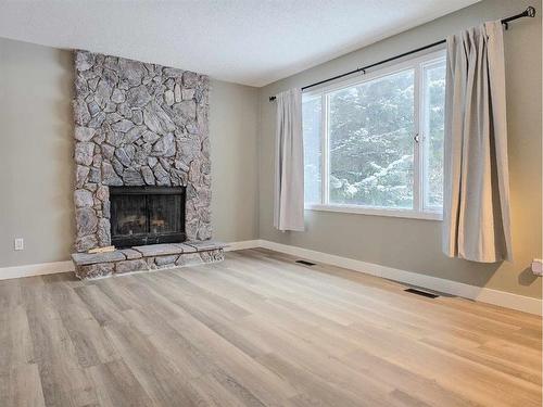 10710 104Th Avenue, Grande Cache, AB - Indoor Photo Showing Living Room With Fireplace