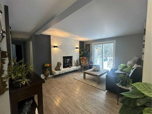 75132 181 Range, High Prairie, AB - Indoor Photo Showing Living Room With Fireplace