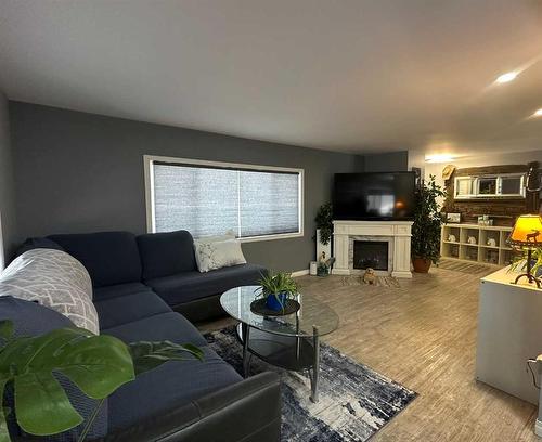 75132 181 Range, High Prairie, AB - Indoor Photo Showing Living Room With Fireplace