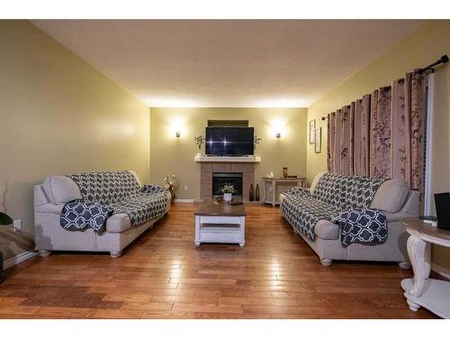 12709 105 Street, Grande Prairie, AB - Indoor Photo Showing Living Room With Fireplace